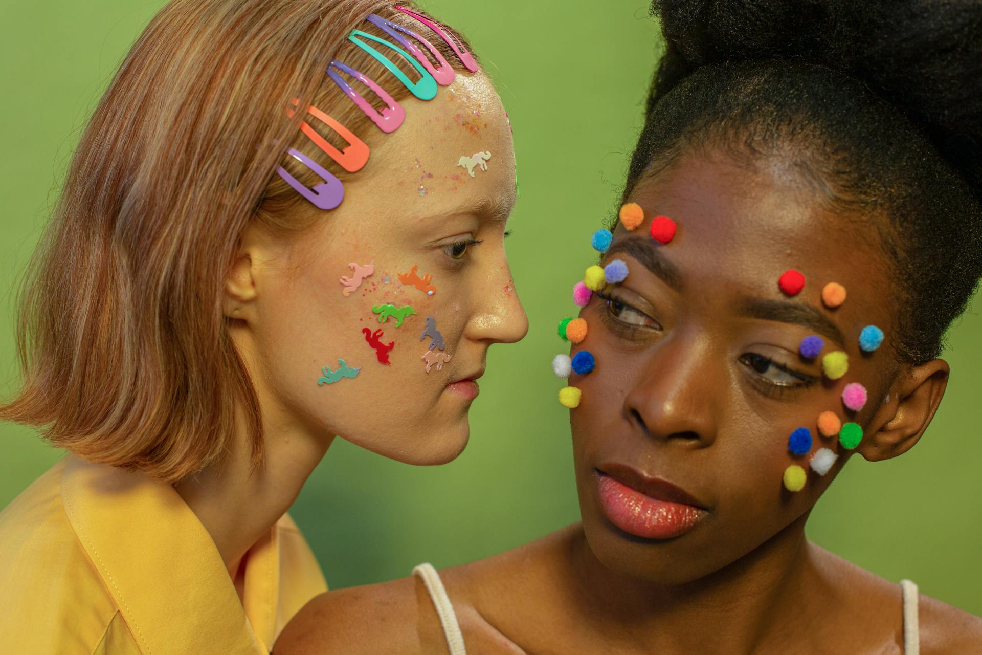 Diverse women with bright colorful stickers and pom pom balls