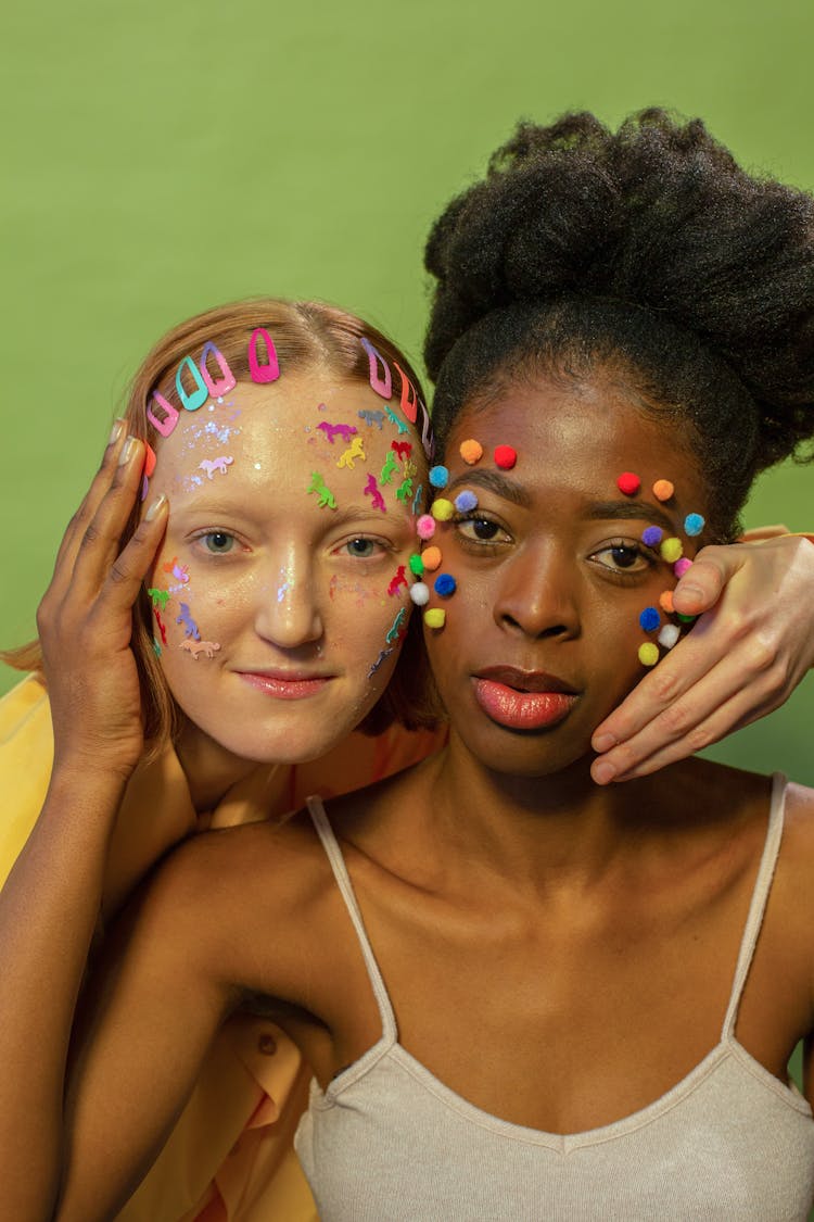 Extravagant Diverse Women With Cotton Balls And Stickers Touching Faces