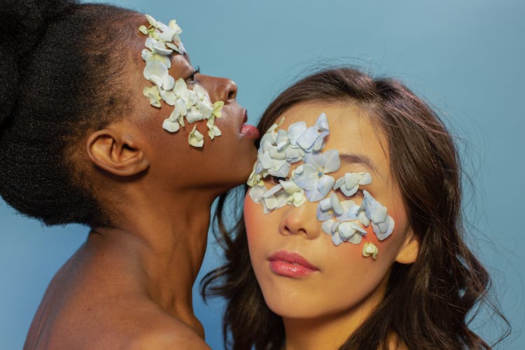 Headshot Of Women With Flowers On Their Faces