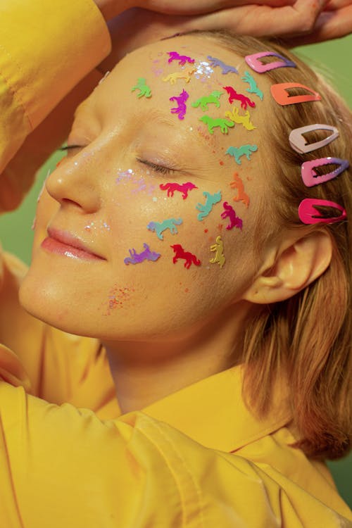 Woman with Stickers and and Glitters on Face