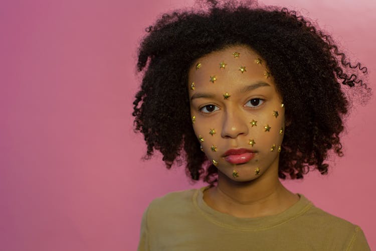 Confident African American Female Teenager With Stars Stickers On Face