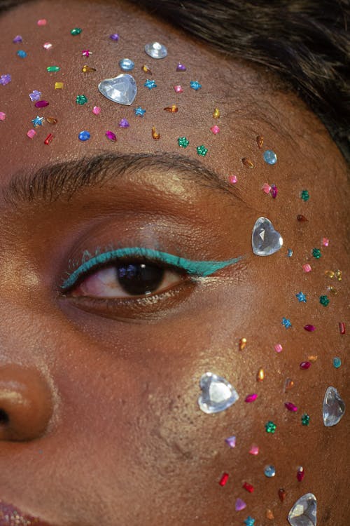 Free Crop black woman with shiny sequins on face Stock Photo