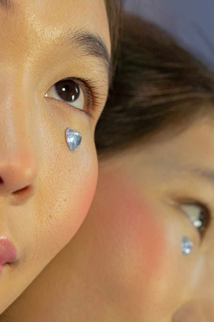 Crop Young Ethnic Woman With Rhinestone On Face Looking Away Near Mirror