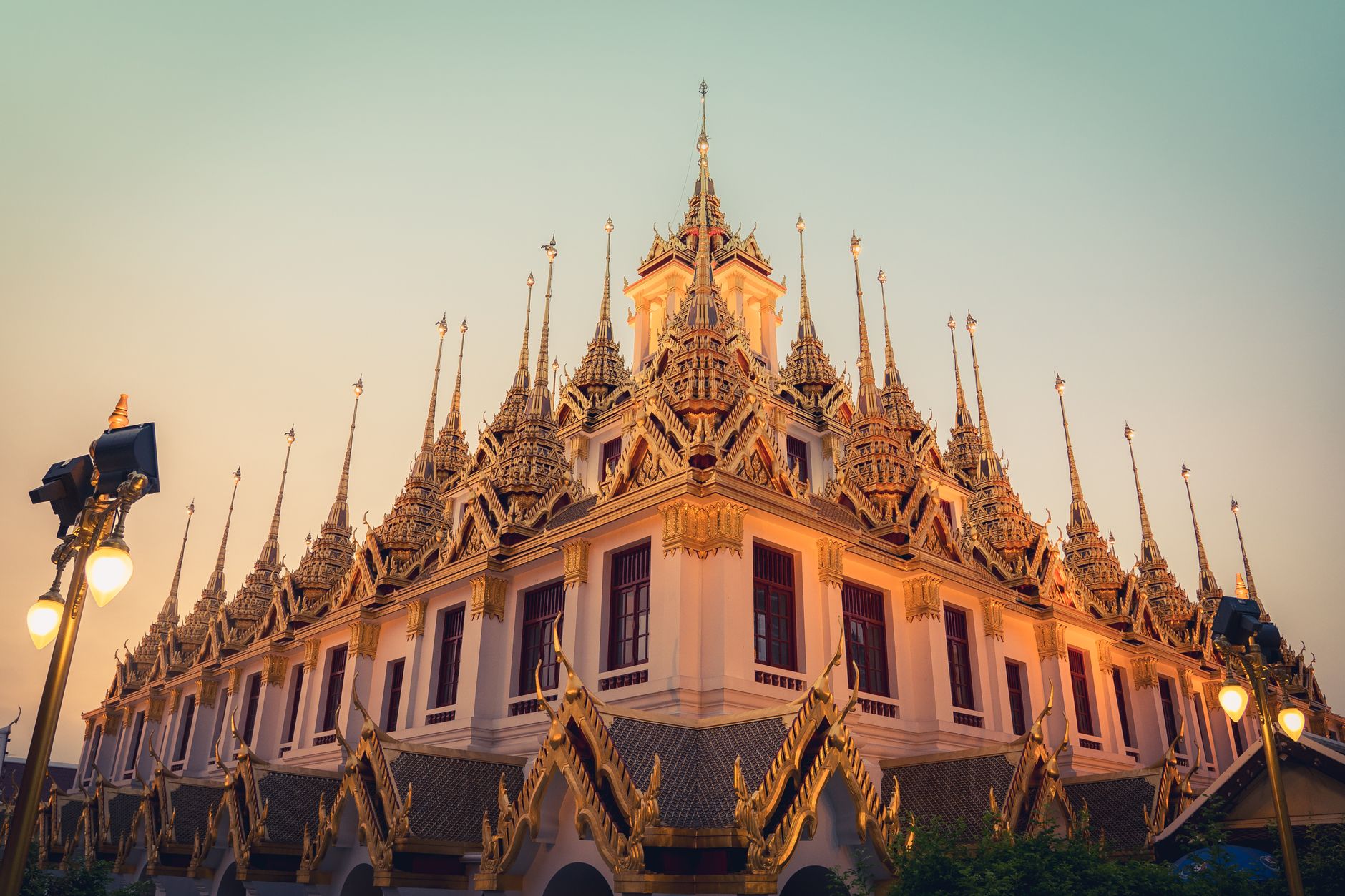 Golden chedi crowning the artificial hill of Wat Saket at sunset