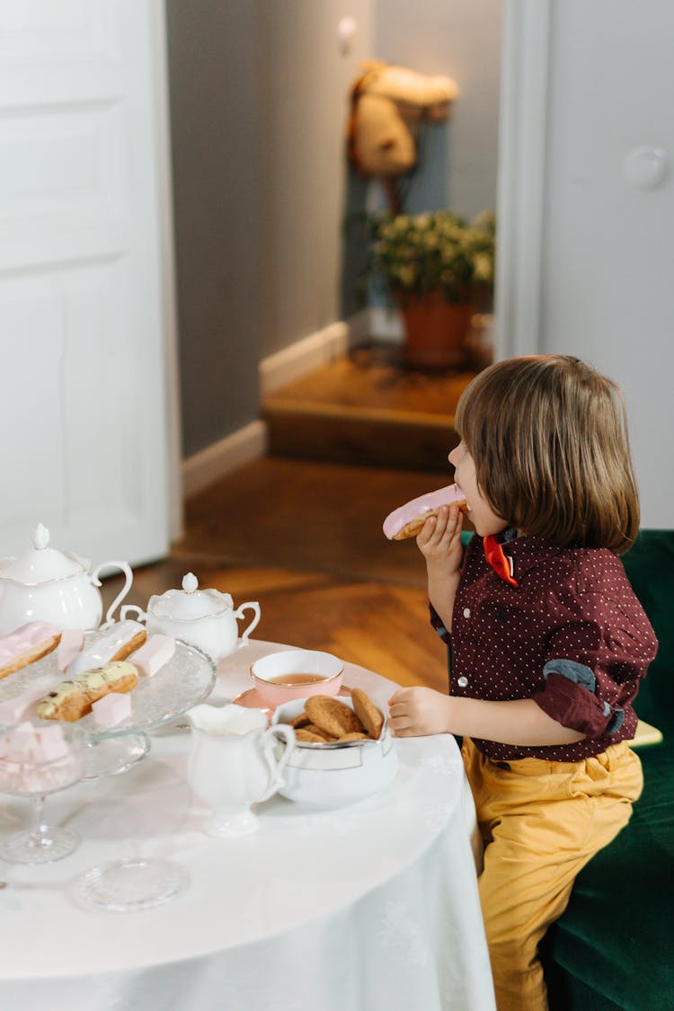 A Cute Boy Eating Alone 