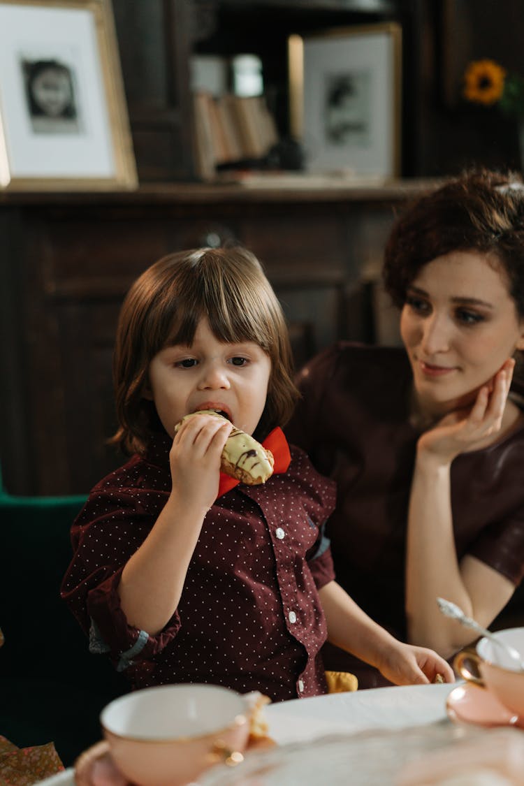 A Young Boy Eating Food