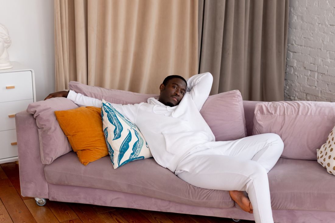 Black man resting in a comfortable home