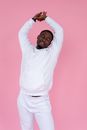 Sleepy black man raising hands up