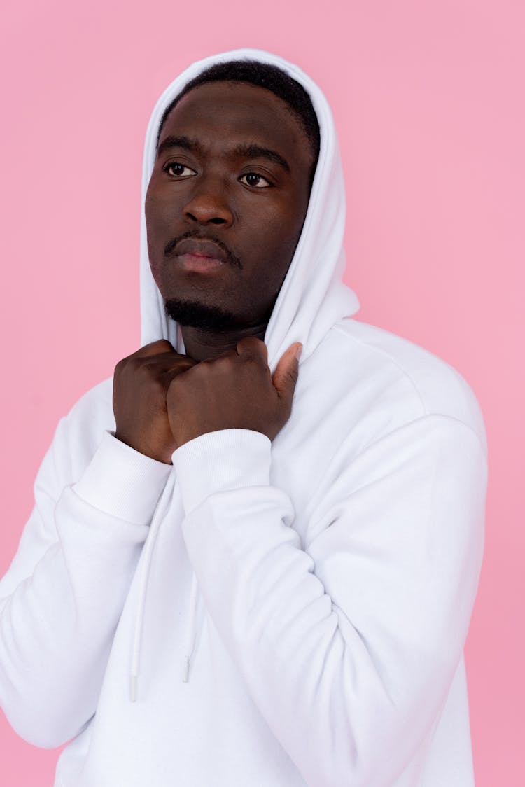 Dreamy Black Man In Hoodie In Studio