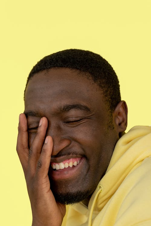 Man in Yellow Hoodie Smiling