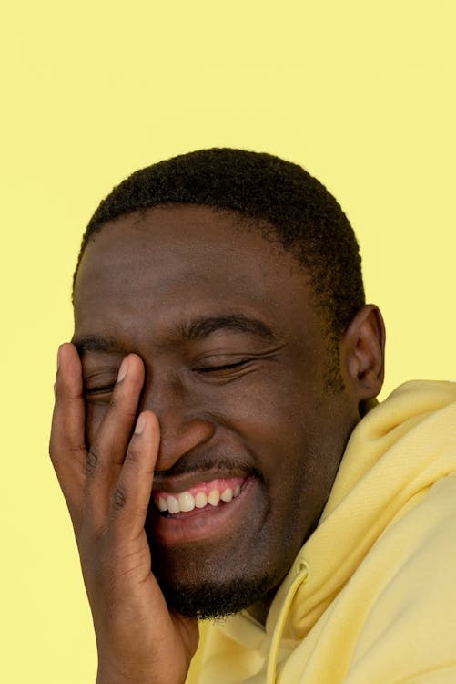 Man in Yellow Hoodie Smiling