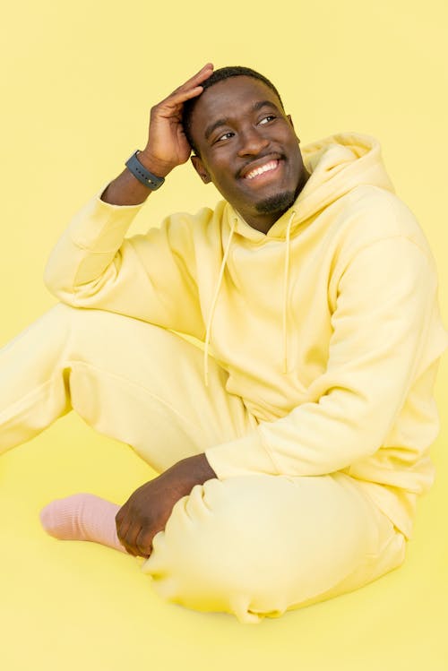 Free A Man in a Yellow Hoodie  Stock Photo
