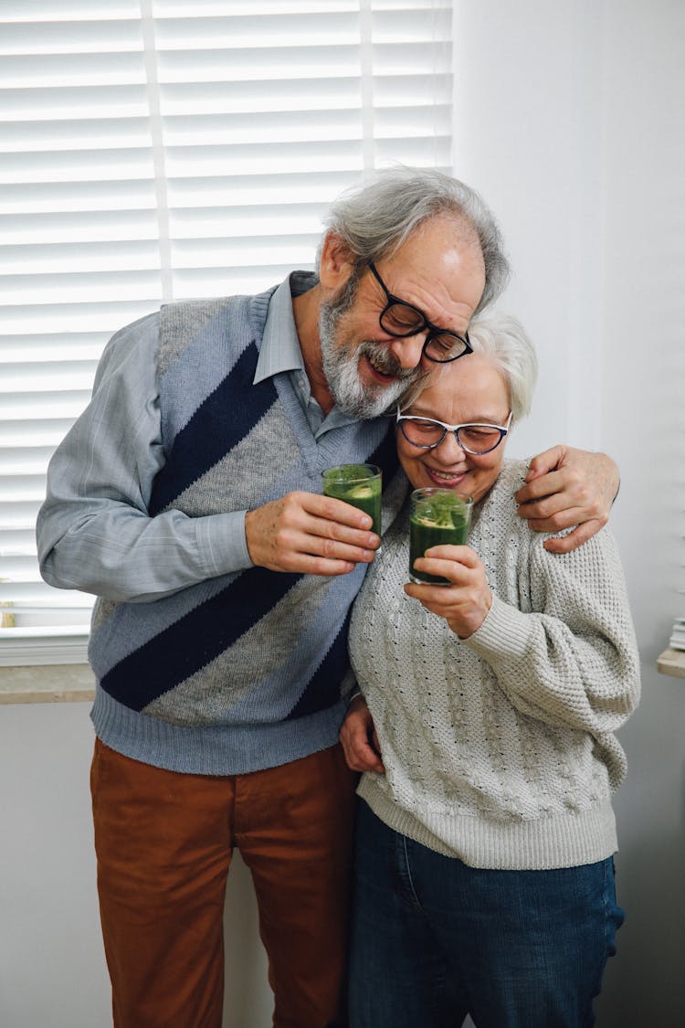 Smiling Old Couple Drinking Healthy Juice