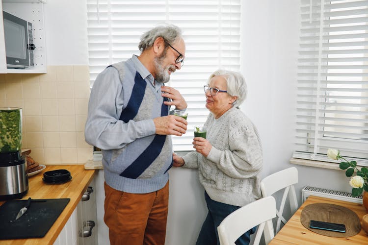 Happy Elderly Couple Drinking Healthy Juice