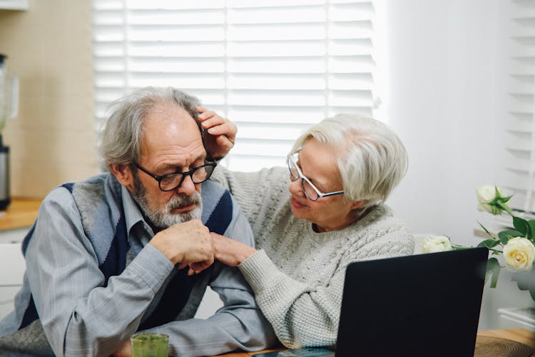 Old Couple Using Laptop At Home Together