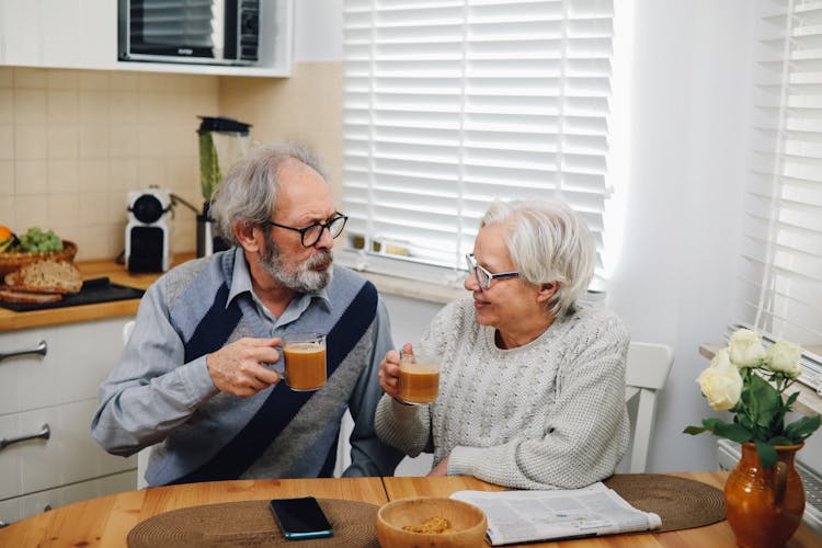 An Elderly Couple Drinking Coffee