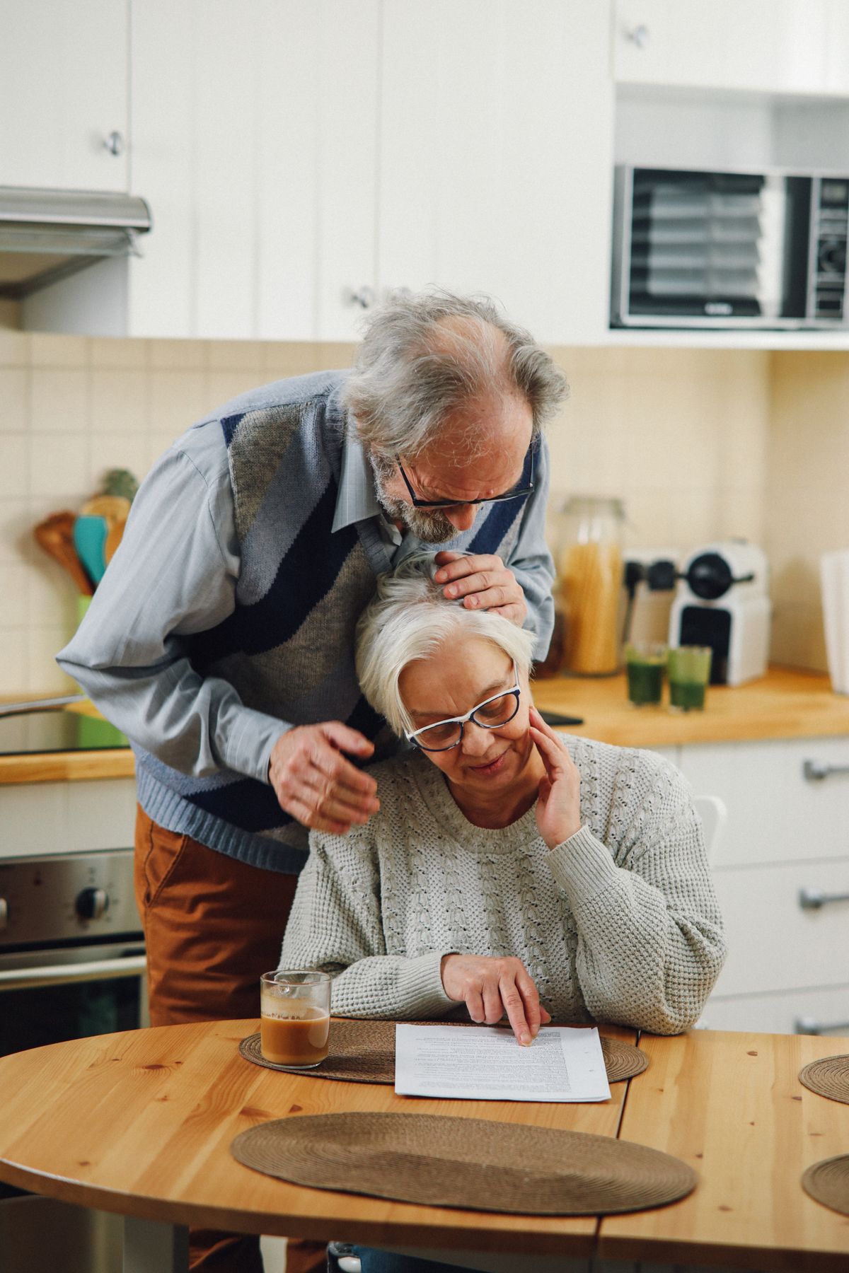 Senior couple over age 65 reviewing Medicare paperwork at home
