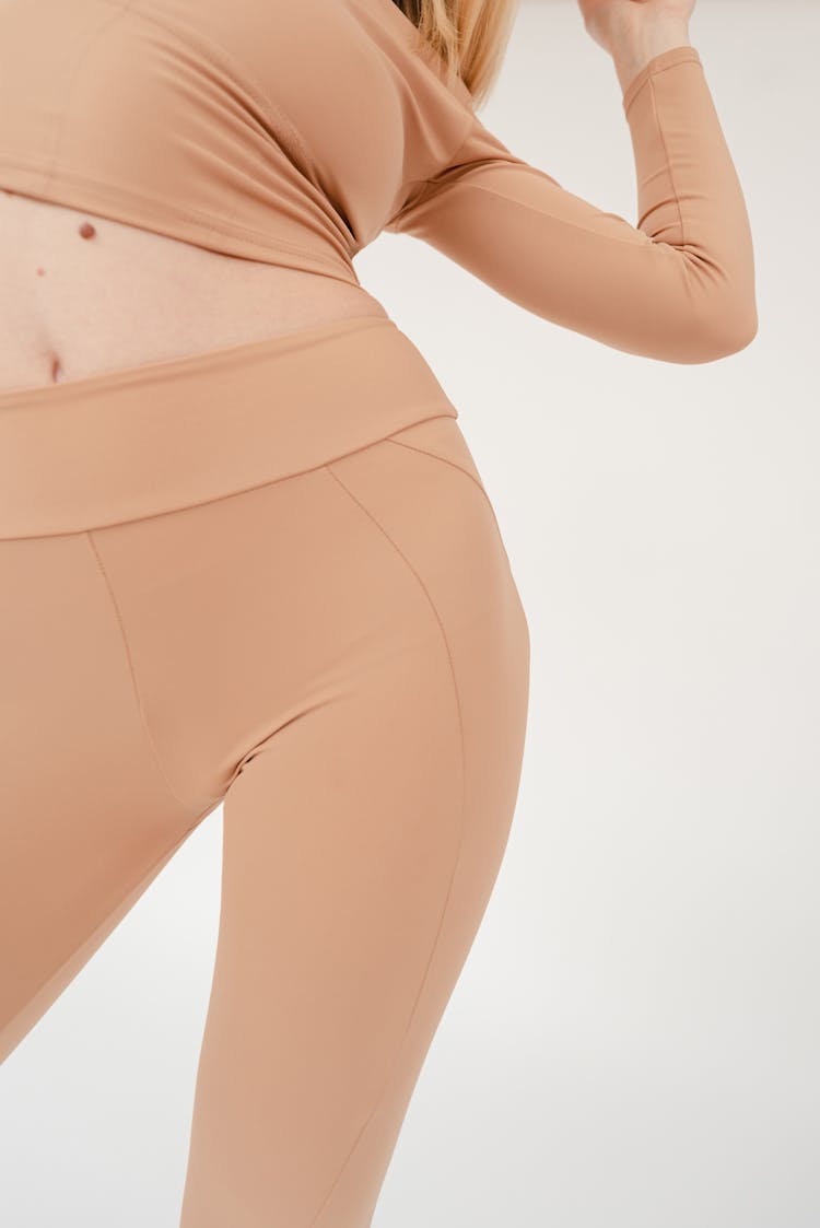 Crop Anonymous Woman Stretching Body In Studio