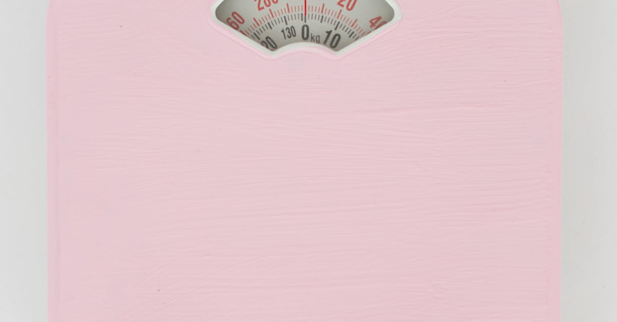 Pink Weighing Scale on a White Surface · Free Stock Photo