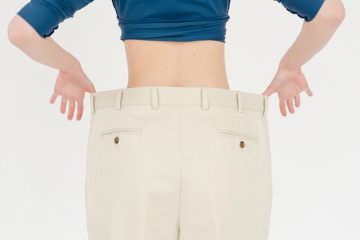 Crop slender woman in oversized pants