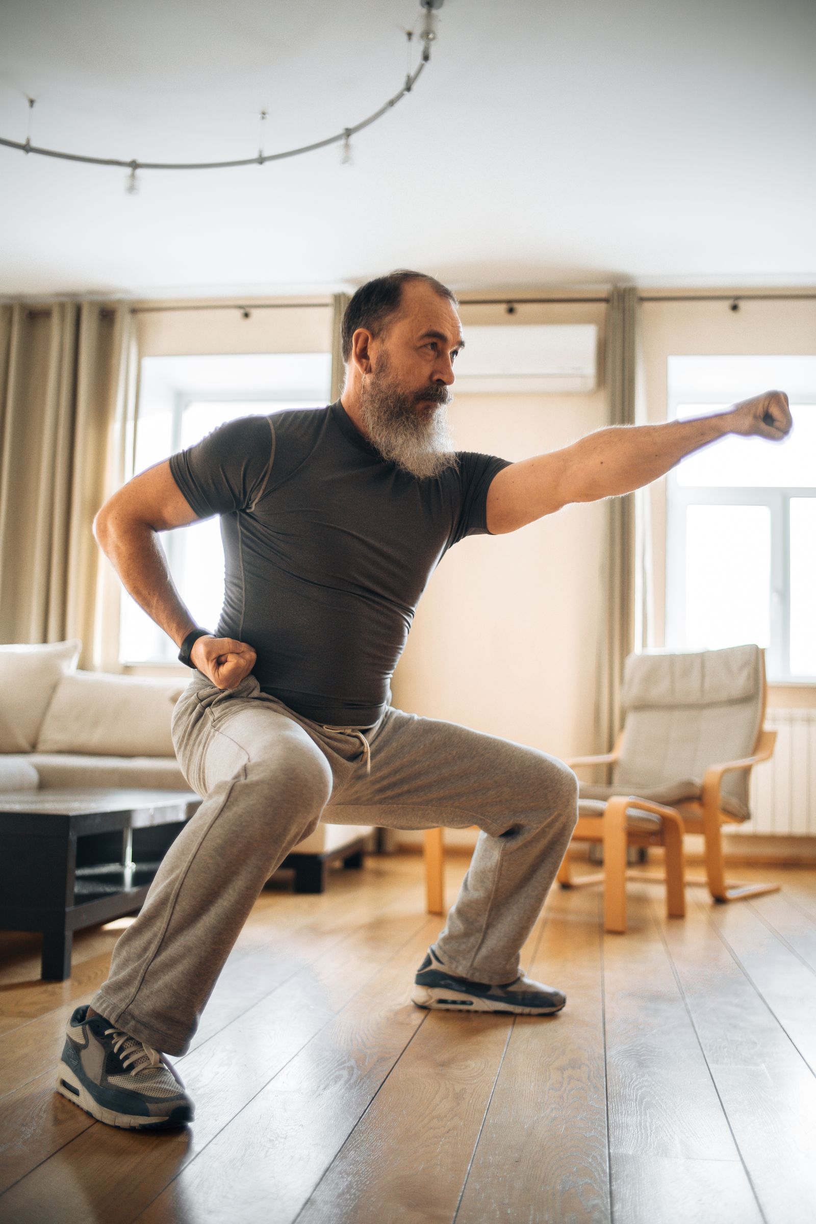 Mature man starting a gentle morning movement routine
