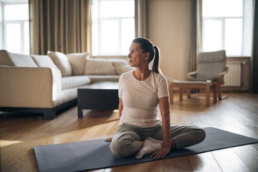 Senior woman doing yoga in a living room, promoting healthy lifestyle and positive aging.