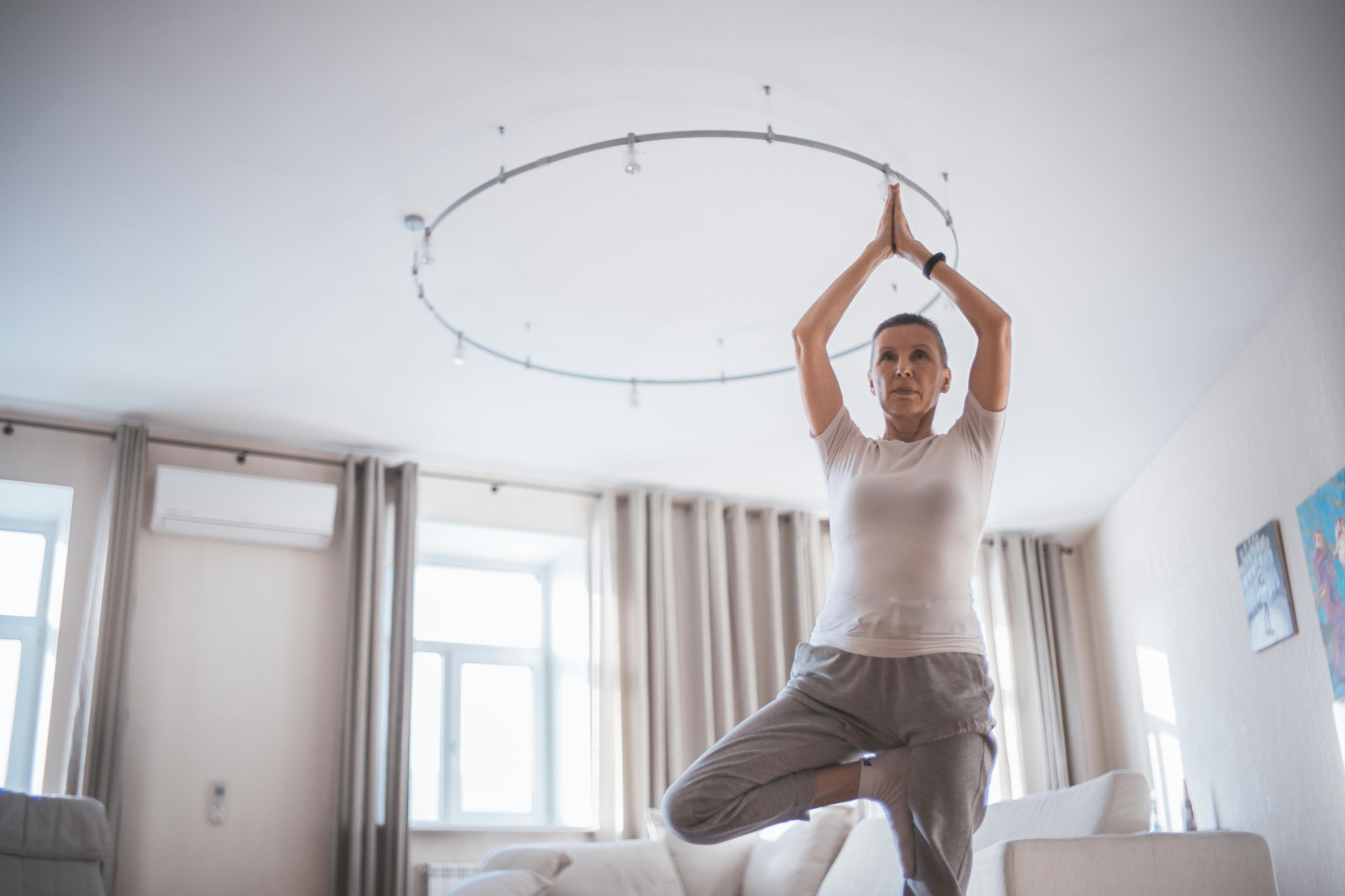 senior practicing balance exercises at home - balance classes for seniors