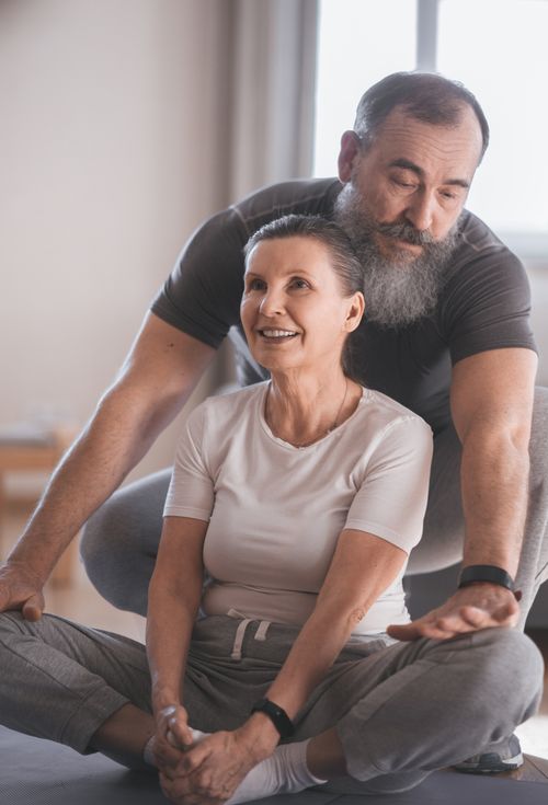 Free Elderly couple engaging in a yoga session at home, promoting health and happiness. Stock Photo