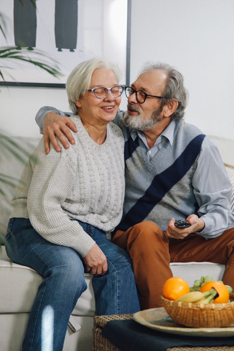 An Elderly Couple On A Couch