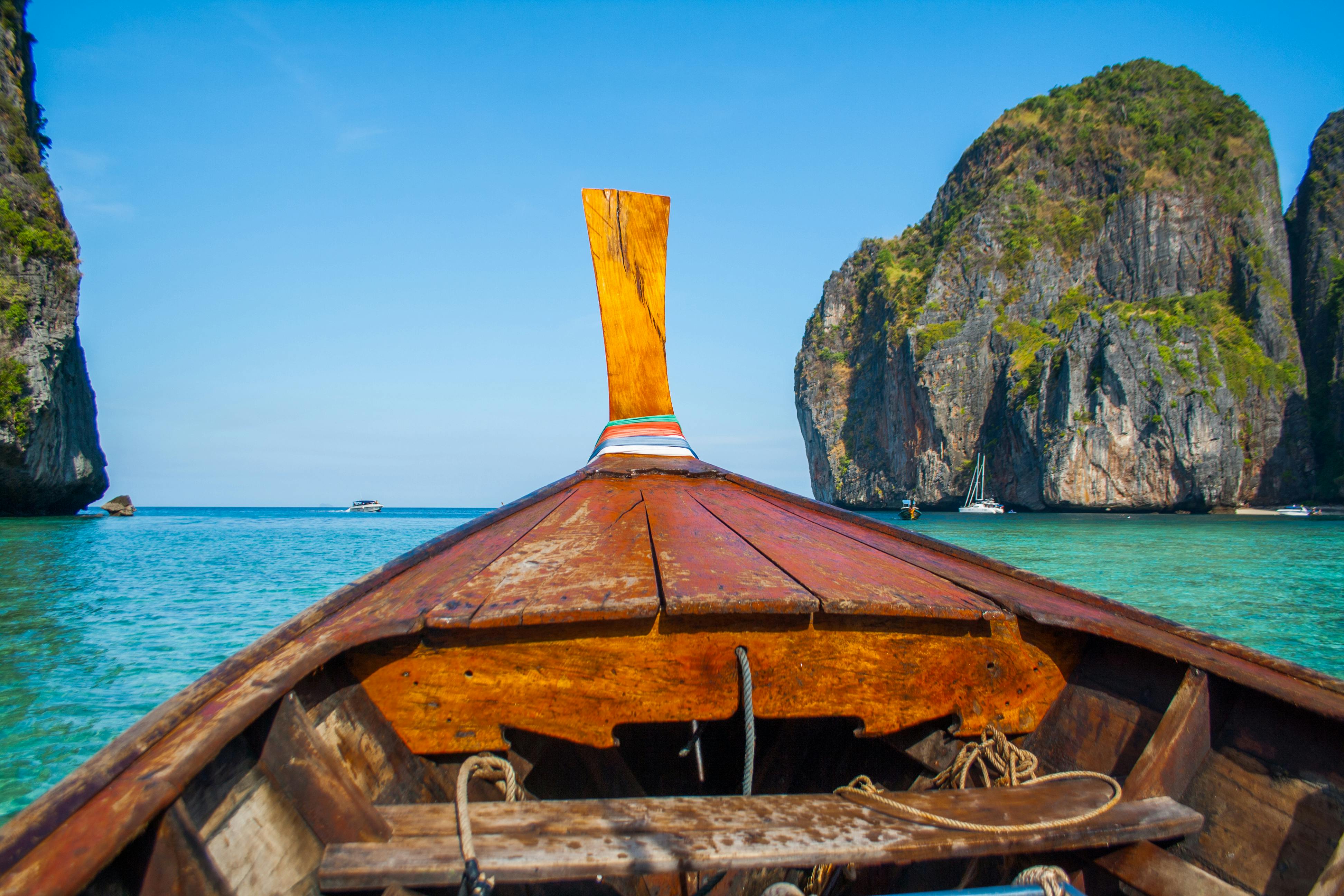 White Boat On Body Of Water During Golden Hour · Free Stock Photo