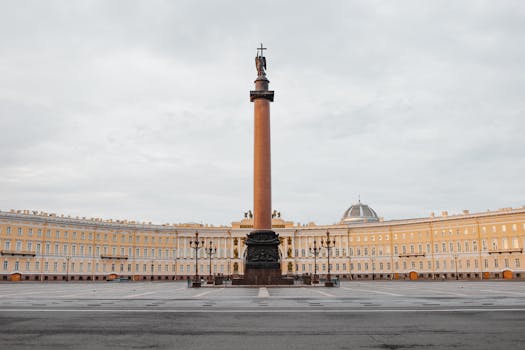 The majestic Alexander Column standing tall in Palace Square, St. Petersburg.