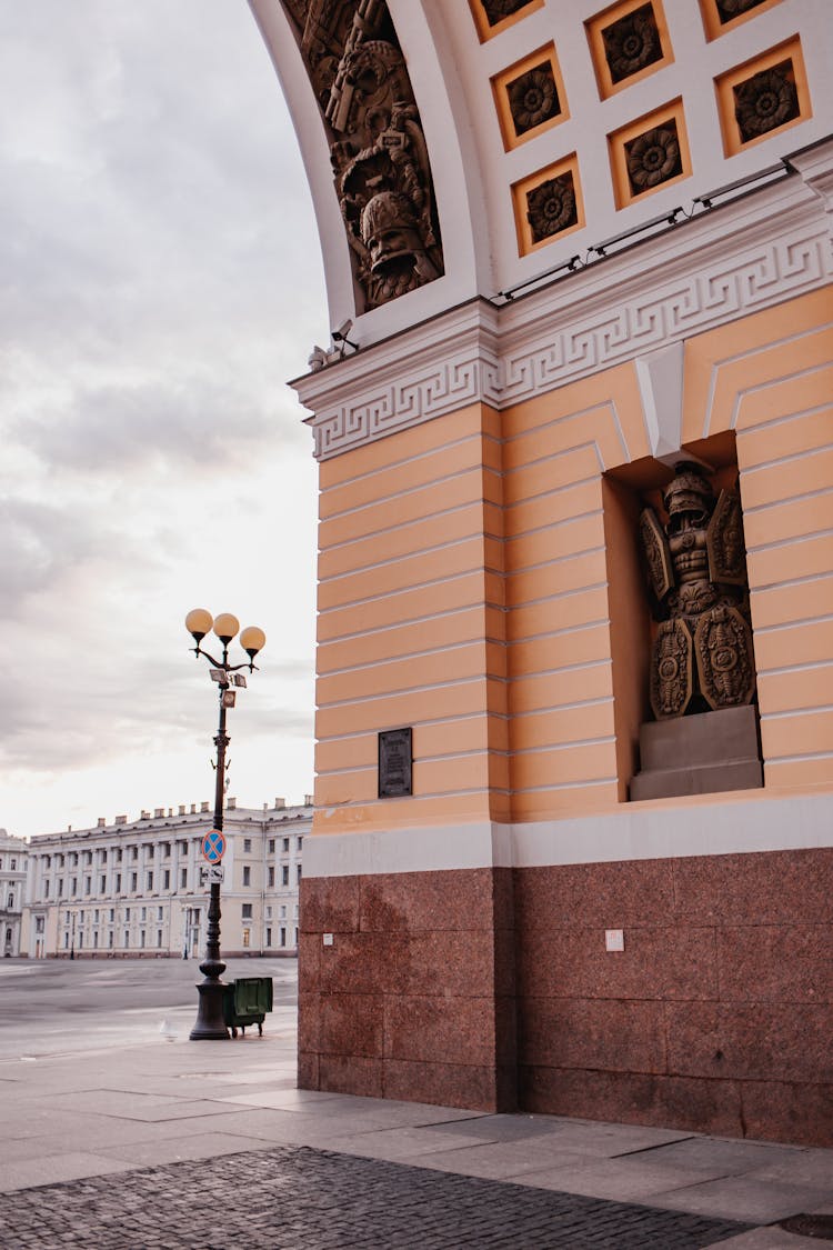 A Brown Statue On A Wall Recess