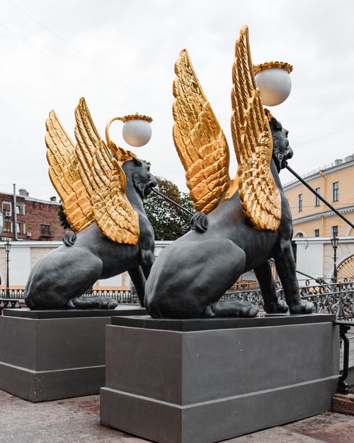 Free View of iconic golden griffin sculptures on Bank Bridge in Saint Petersburg, Russia. Stock Photo