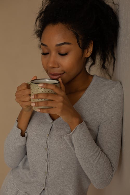 Woman Drinking a Cup of Coffee