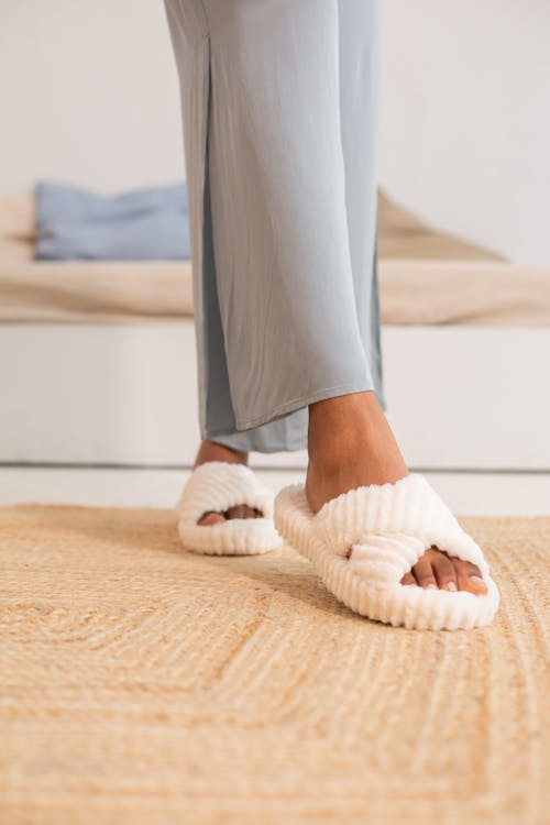Free Close-up Woman Wearing Comfortable Fluffy Slides  Stock Photo