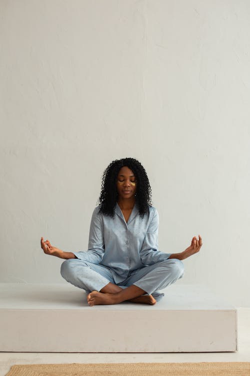 Woman Sitting and Meditating