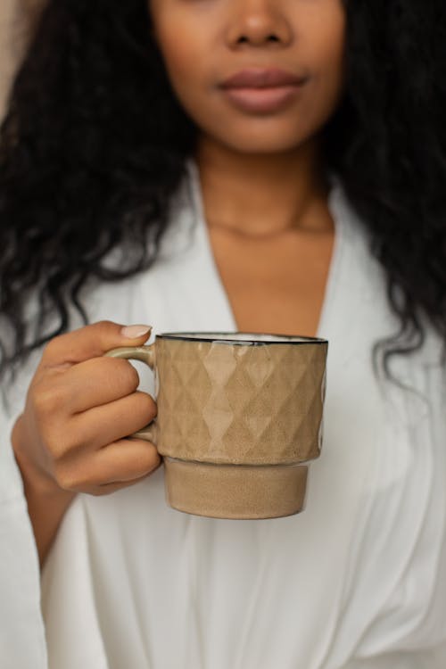 Woman Holding a Cup