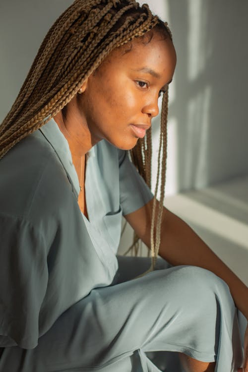 Free Woman with Braided Hair in Comfortable Sleepwear Stock Photo