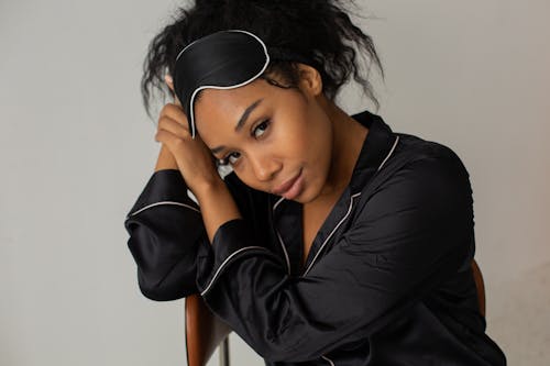 Free Close-Up Shot of a Woman Wearing a Sleep Mask Stock Photo