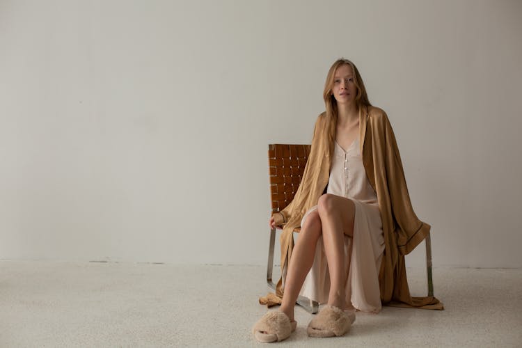 Blond Woman Sitting On Chair