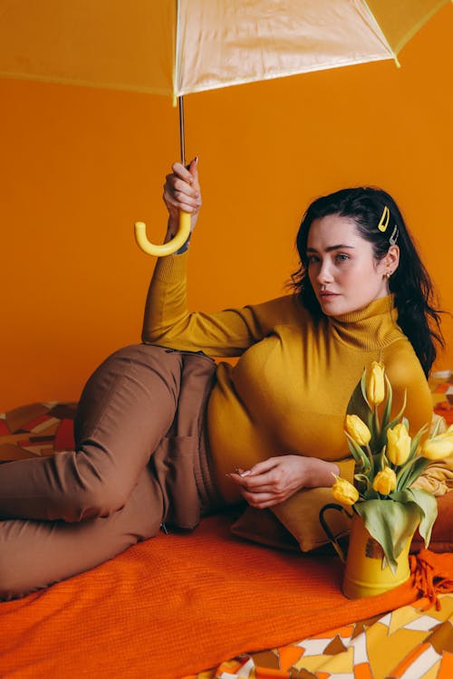 Woman Holding A Yellow Umbrella