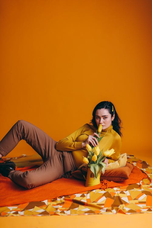 Woman Holding A Yellow Flower