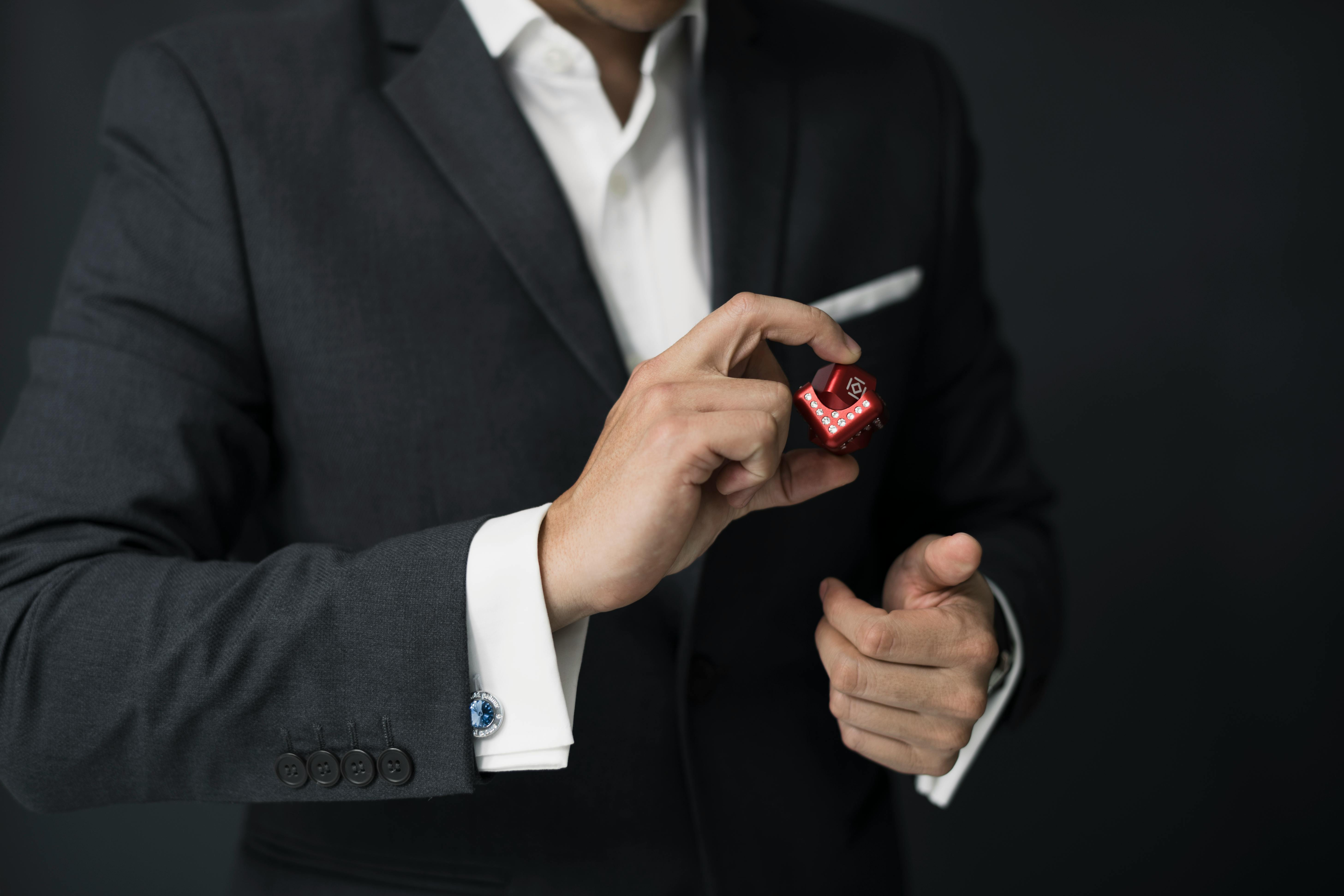 man holding red cube