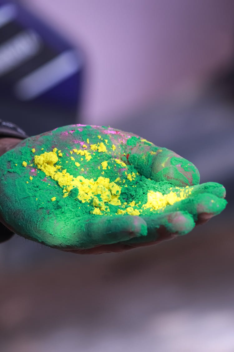 A Hand Covered With Holi Powder 