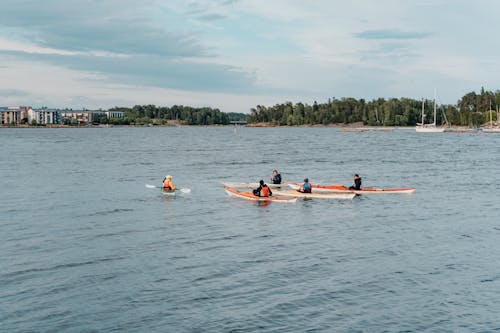 People Riding on Kayak on River