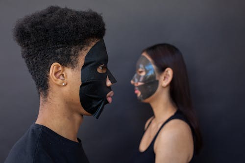 Free Ethnic models wearing moisturizing facial cotton masks Stock Photo