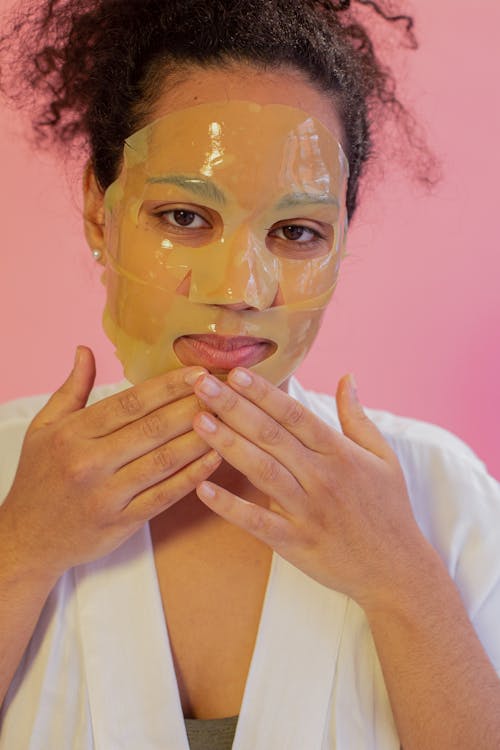Free Black woman with hydrogel mask on face Stock Photo