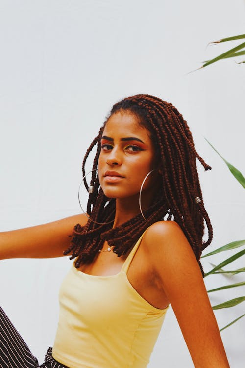 Close-up of a Beautiful Woman in Yellow Tank Top