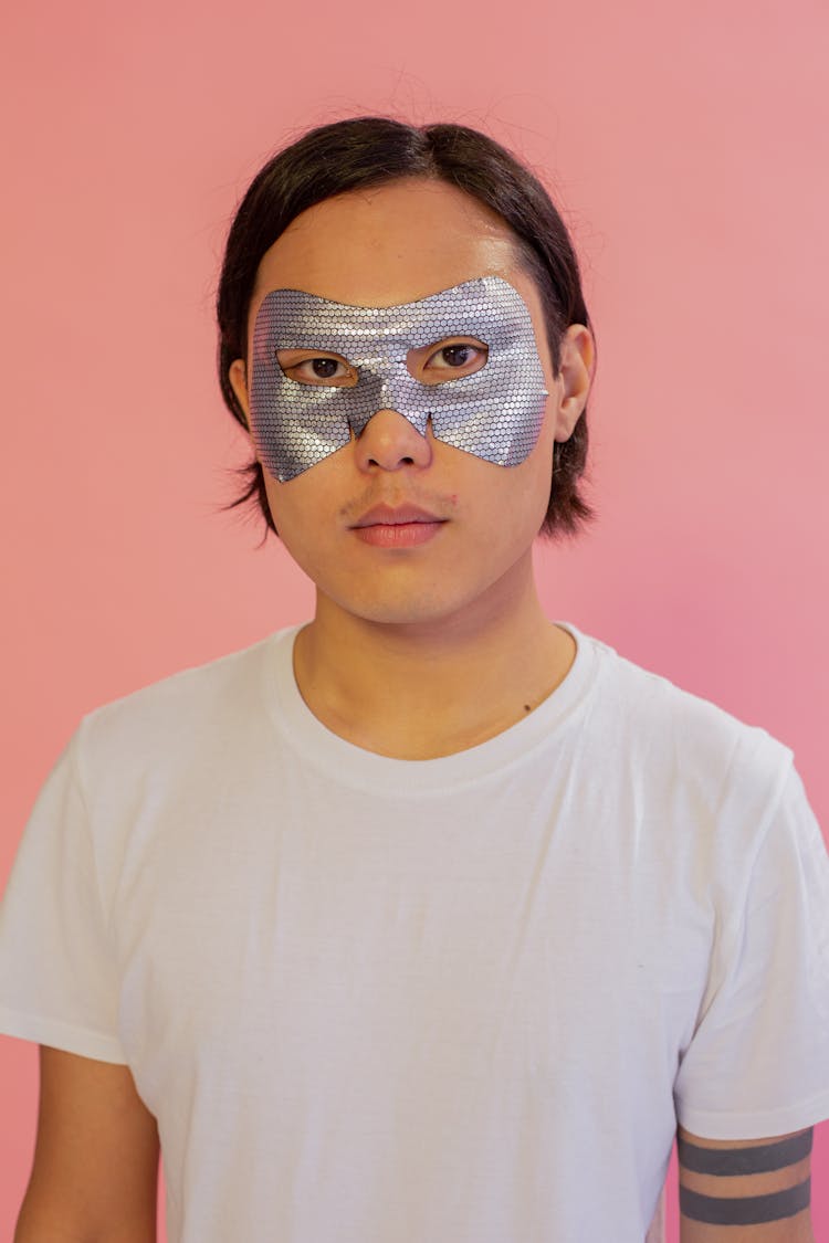 Serious Asian Man Wearing Eye Mask