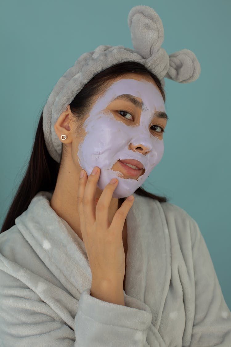 Young Asian Woman With Moisturizing Facial Mask